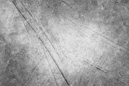 Free From above black and white of textured backdrop of rough metal wall with lines and shabby surface Stock Photo