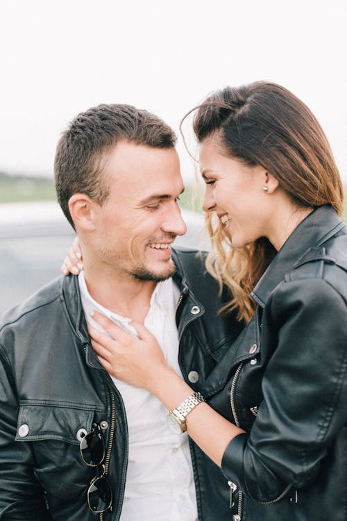 Couple in Leather Jackets Smiling 