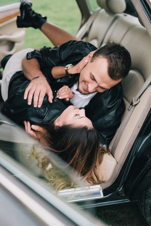 Man and Woman Lying Inside the Car