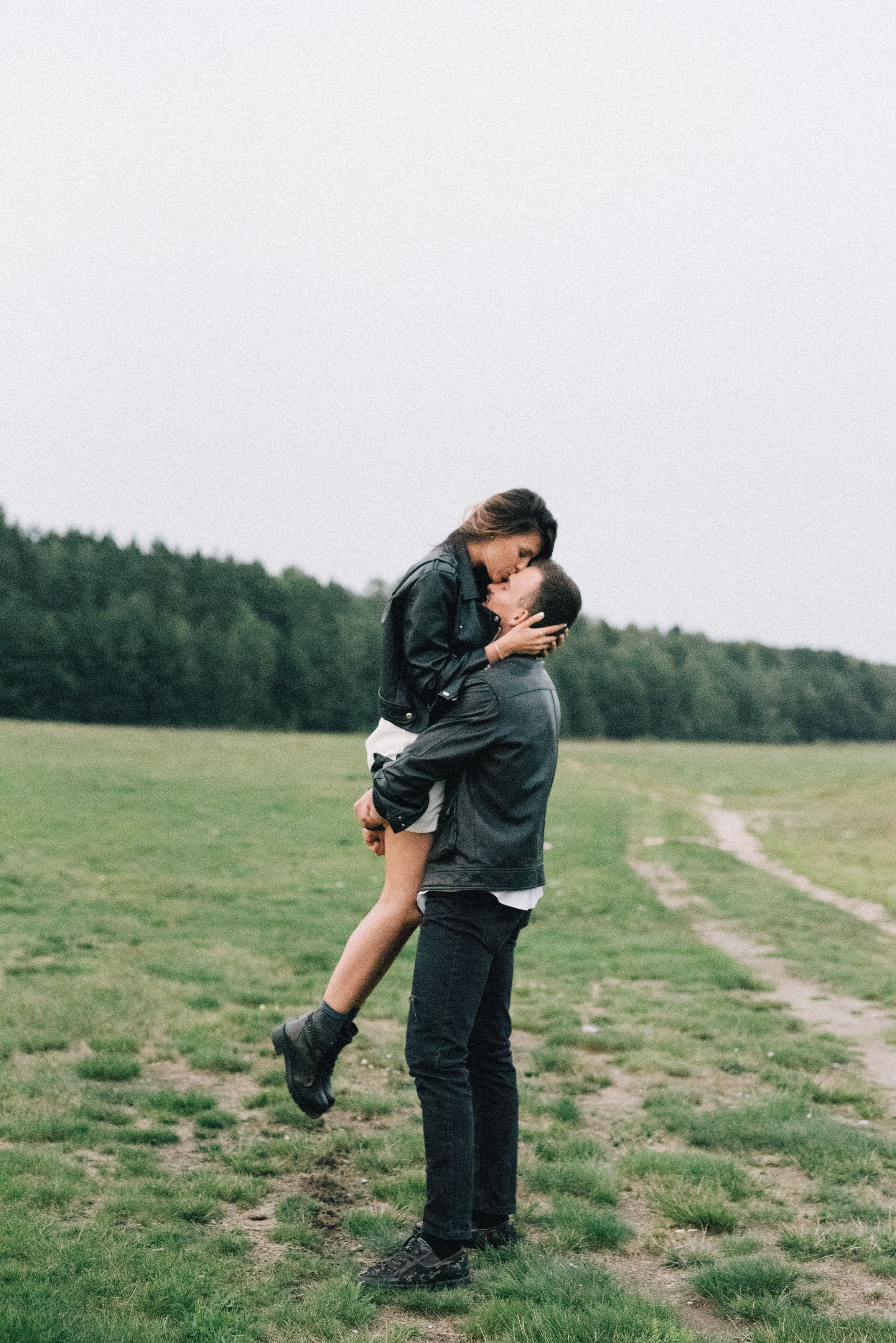 Woman in Leather Jacket and Man in Brown Jacket Kissing · Free Stock Photo