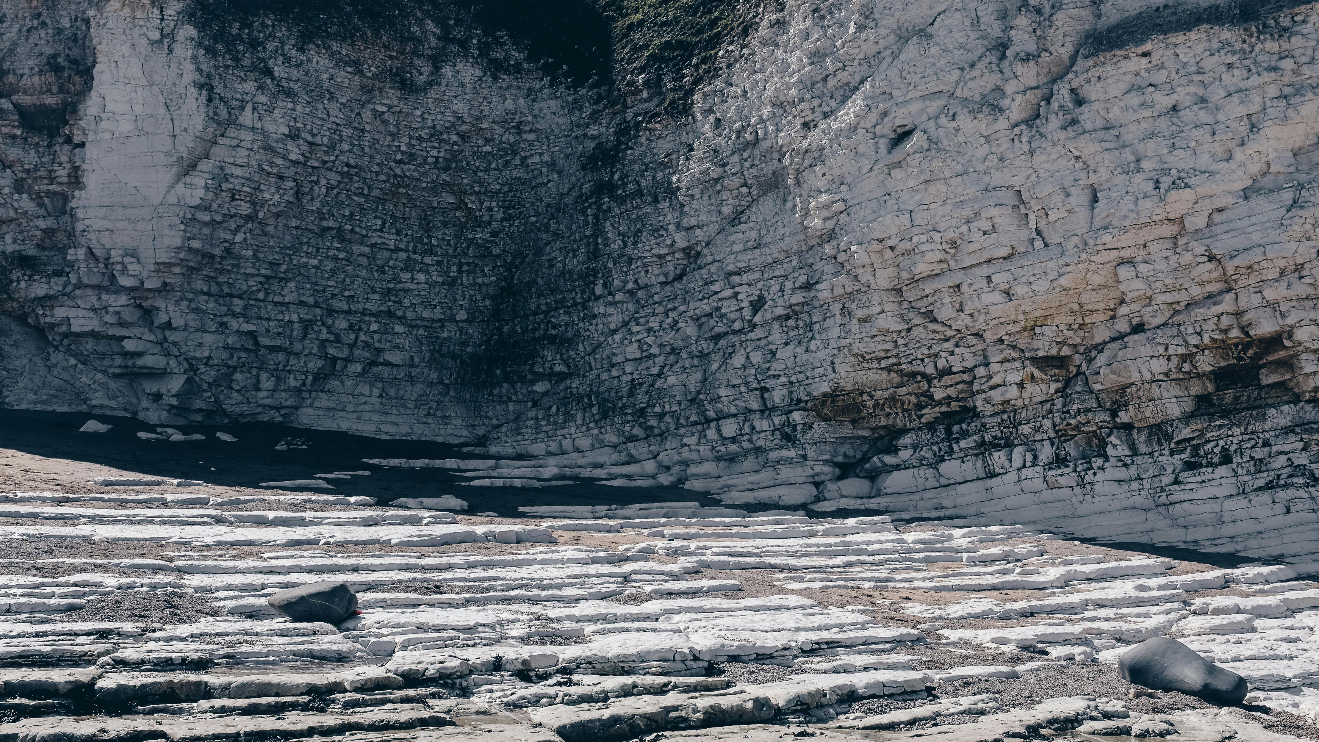 Rough chalk formations on rocky sea shore · Free Stock Photo