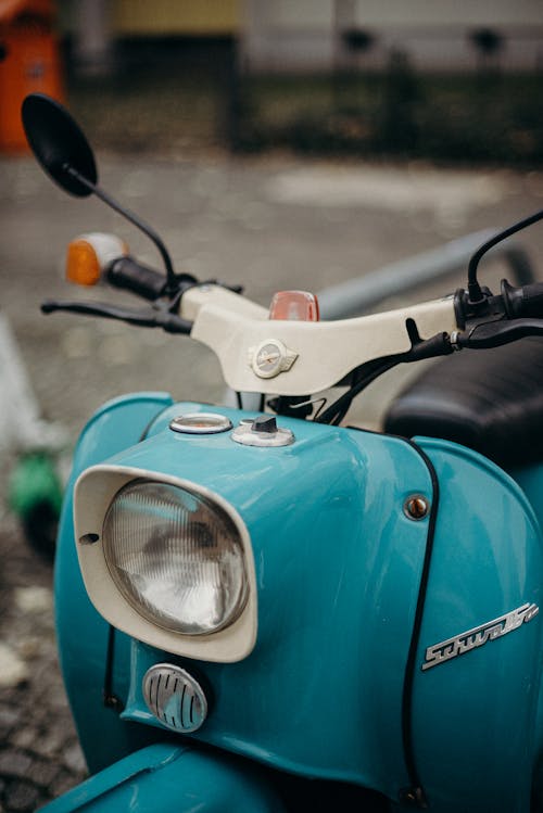 Blue and Black Motorcycle With Red and White Sticker on Top