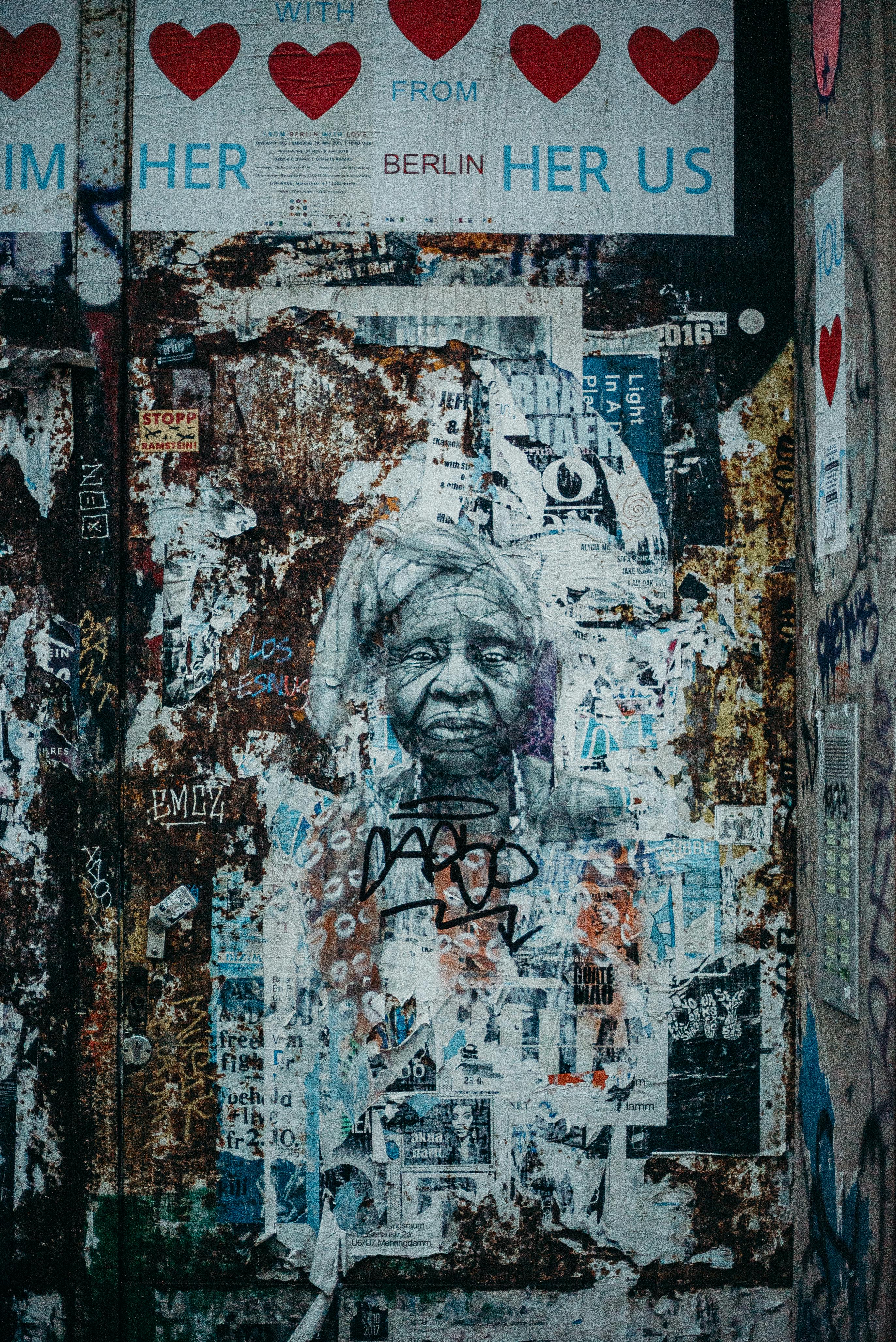 Detailed portrait of a woman in Berlin's urban graffiti scene, showcasing vibrant street art.
