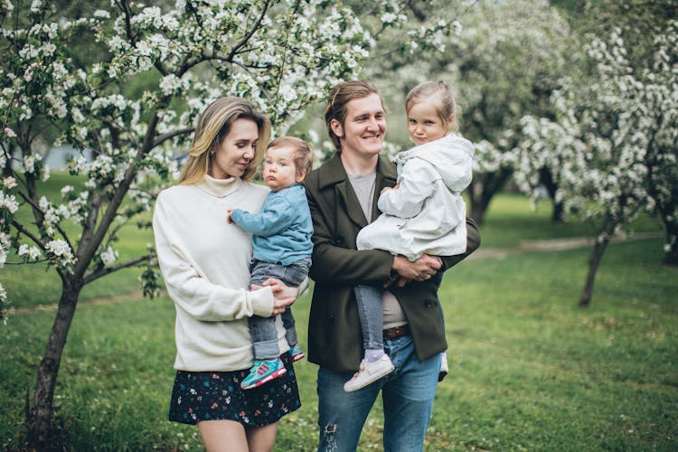 A Family Walking In The Park