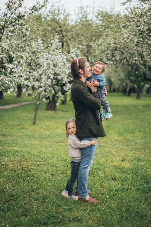 Free A Father with His Children in the Park Stock Photo