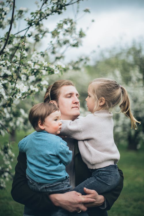 Free Father With his Children at a Park Stock Photo