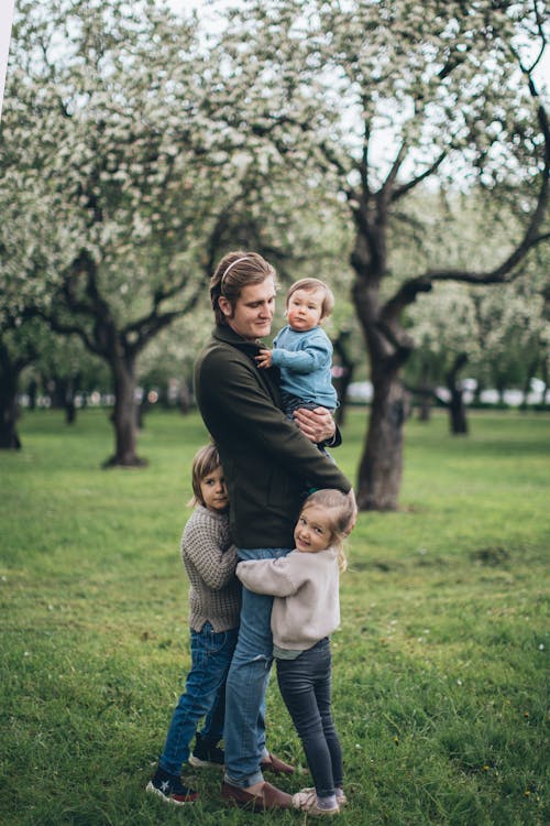 Free Father With his Children at a Park Stock Photo