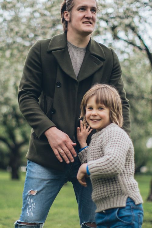 Father walking with his smiling son in the park