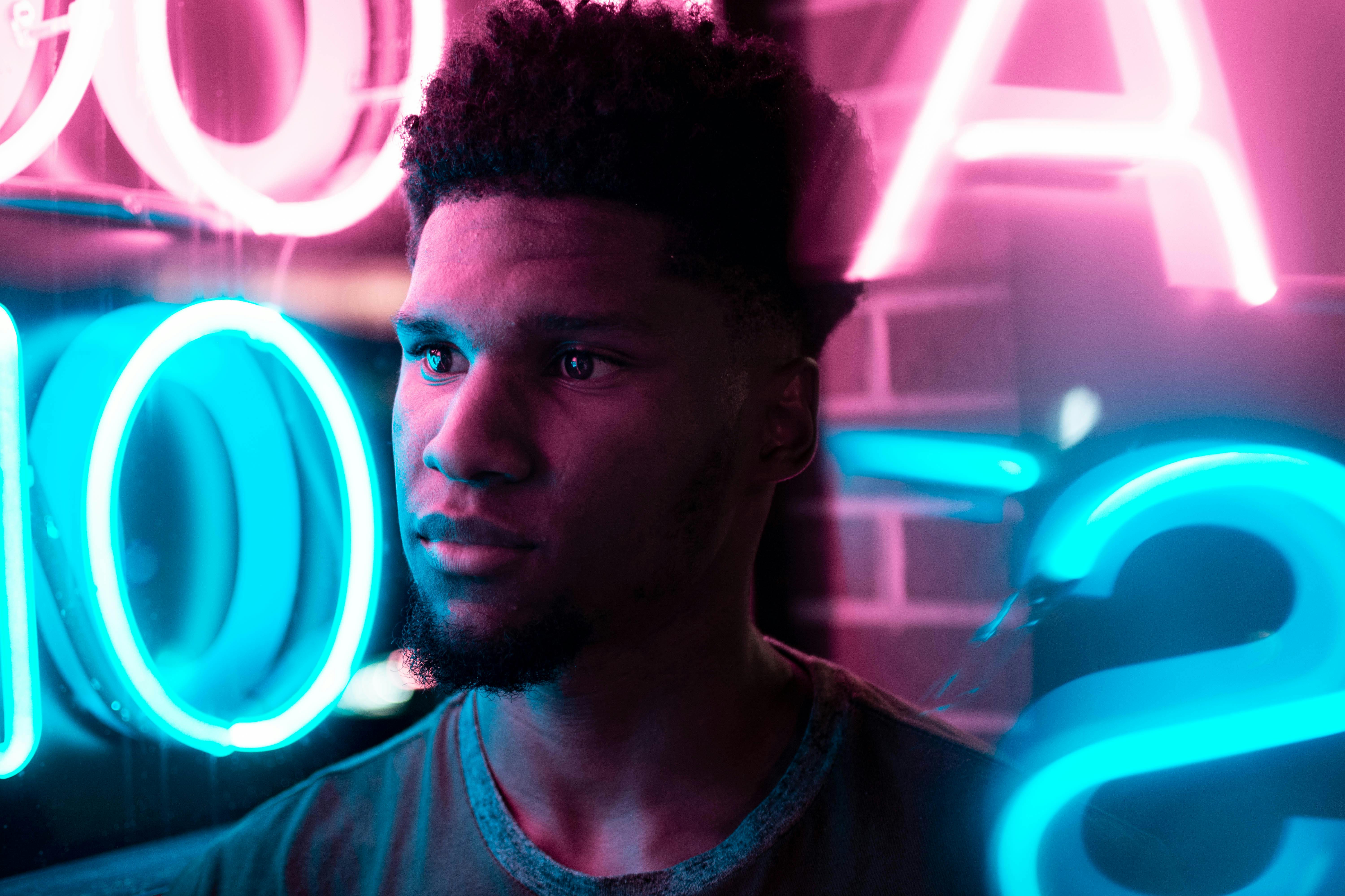 Free stock photo of black man, blue neon, light reflection