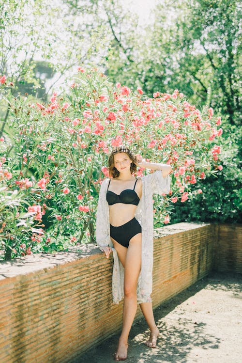 Free Woman Wearing a Cover Up Over her Swimsuit Stock Photo