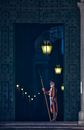 Guard protecting entrance of aged building at night