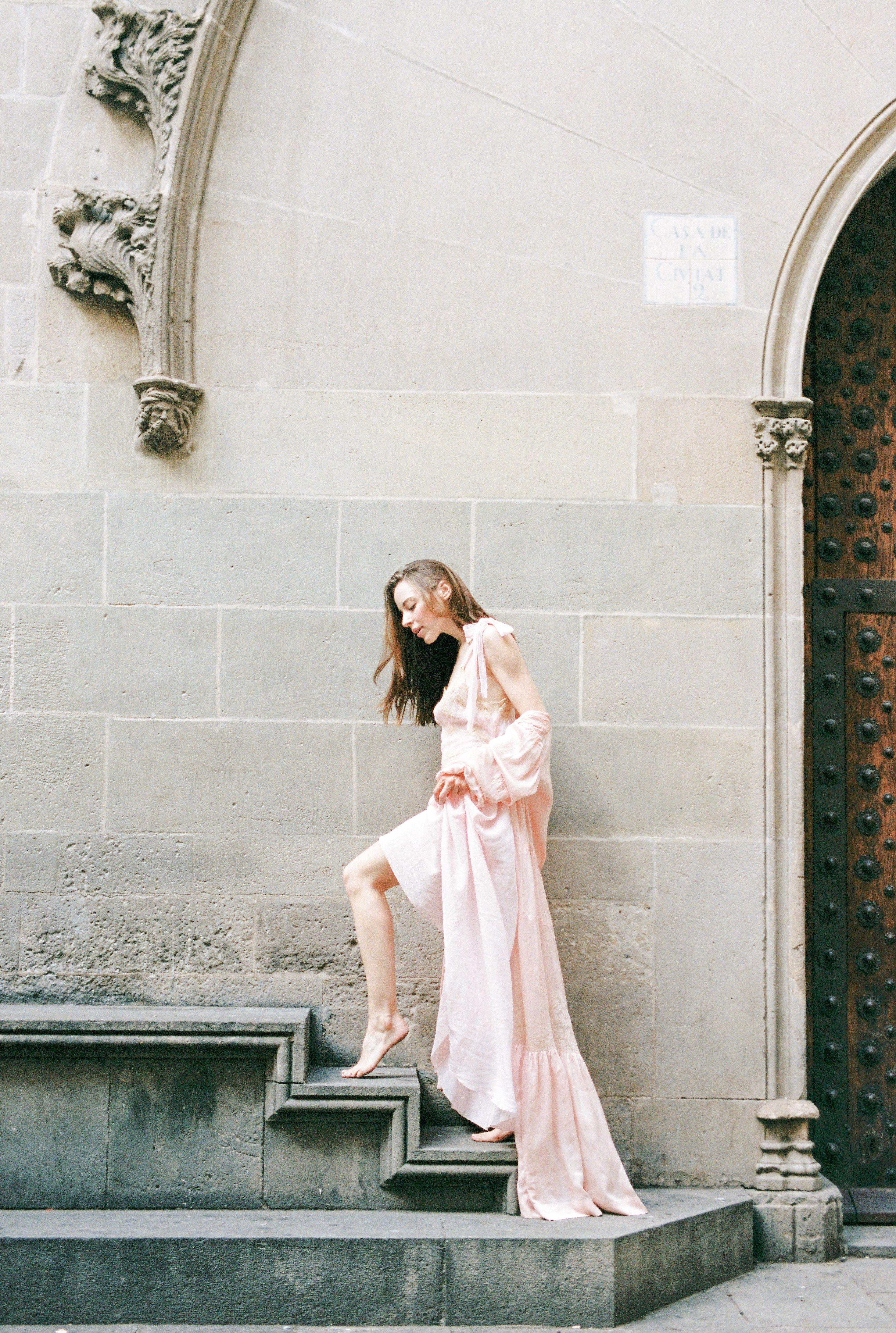 Woman in Pink Dress Standing on Concrete Stairs · Free Stock Photo