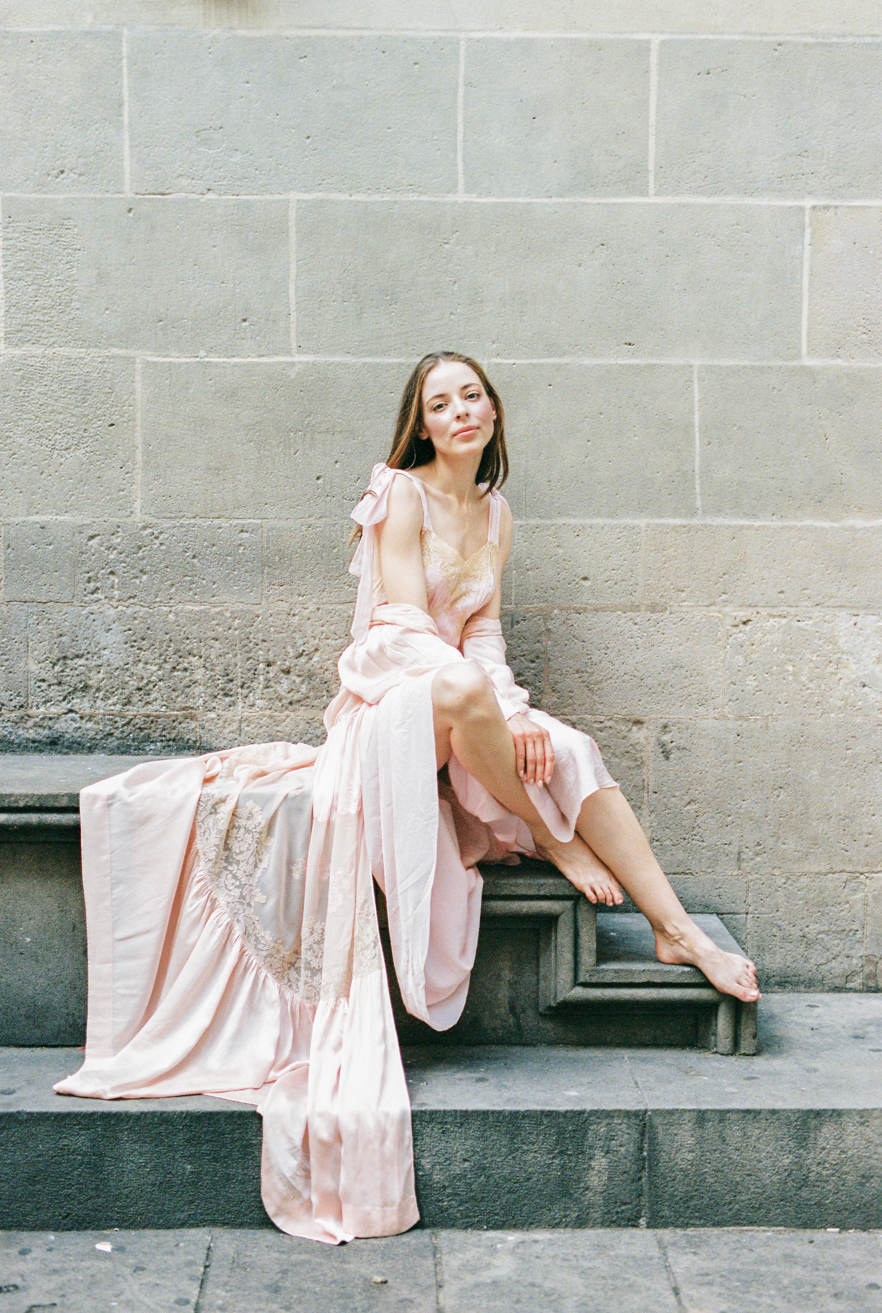 Woman in Pink Dress Sitting on Concrete Stairs · Free Stock Photo