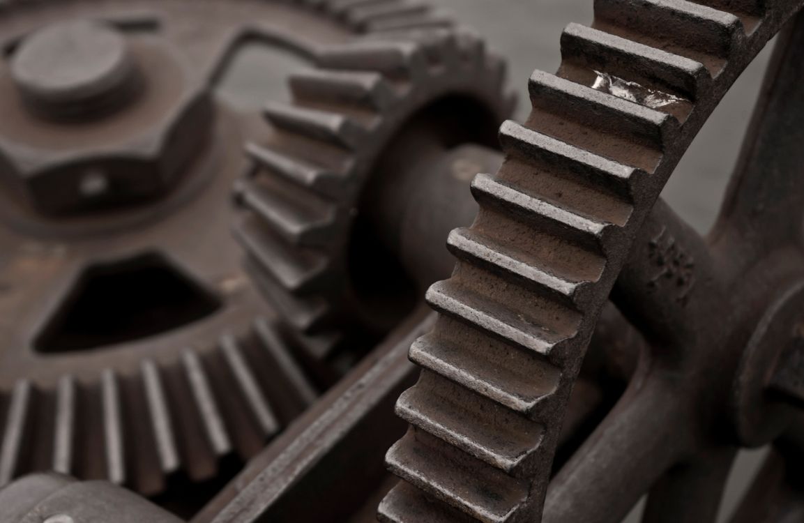 Close-up of a heavy gray industrial gear recovered from a foundry