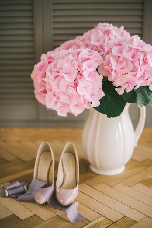 Pink Flowers in White Ceramic Vase