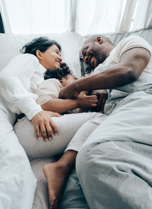 Happy Family in Bed