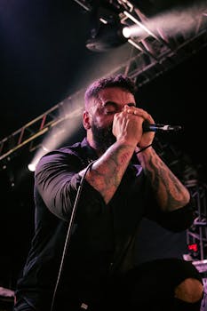 Energetic singer performing live on stage with vibrant lighting in Rio de Janeiro, Brazil.