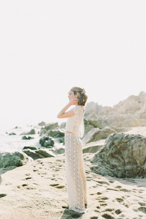 Woman in White Dress Standing on the Shore