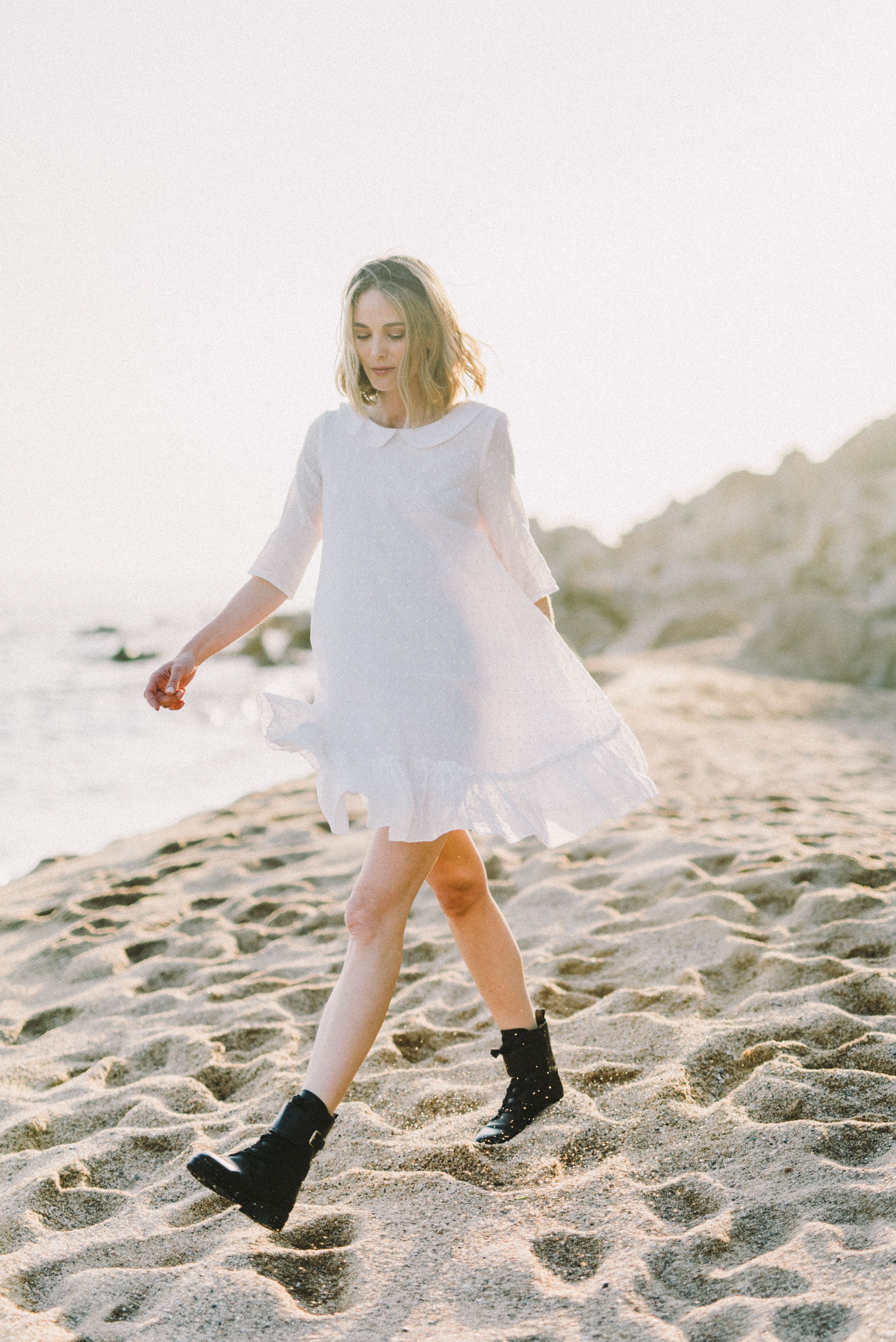 Woman in White Dress Walking on Sand · Free Stock Photo
