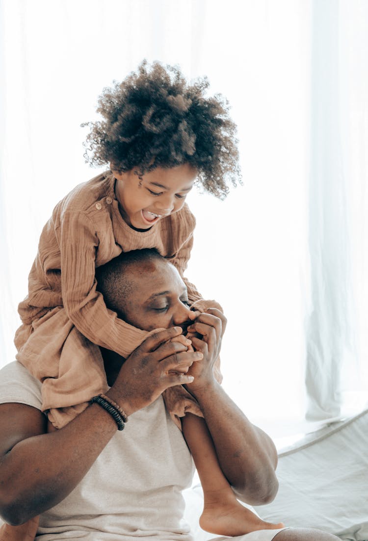 Black Father And Child Having Fun Together