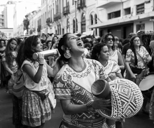 Crowd of ethnic women in traditional clothes at carnival