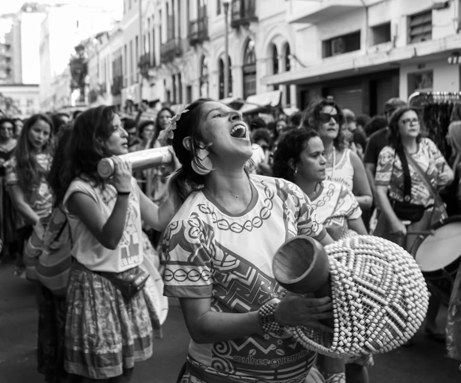 Crowd of ethnic women in traditional clothes at carnival