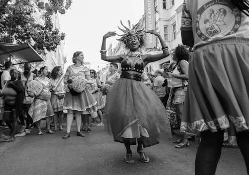 Group of diverse people singing and dancing at traditional event