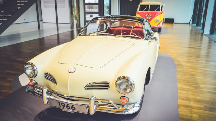 A Vintage Yellow Car In Showroom