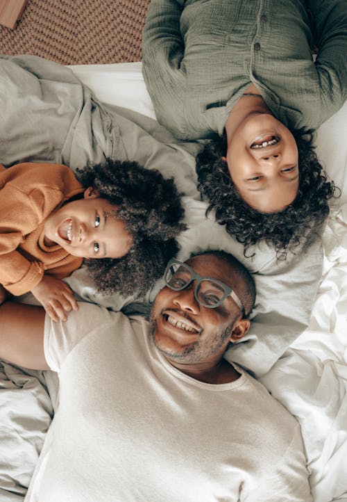 Free Father in Bed with his Children Stock Photo