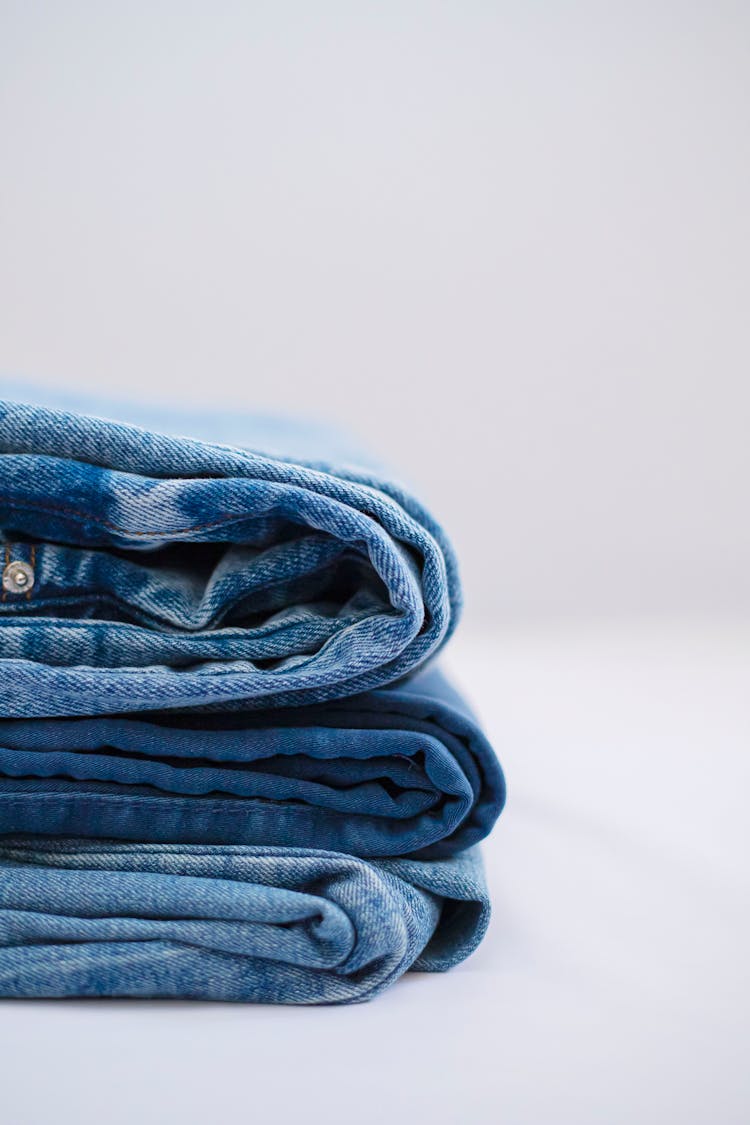 A Stack Of Folded Denim Pants