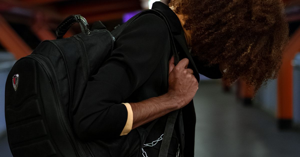 Black man with backpack standing in underground · Free Stock Photo