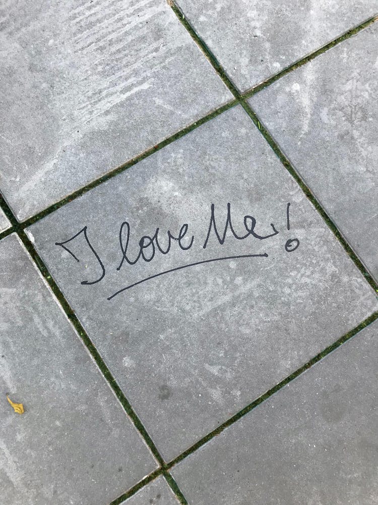 I Love Me Words On Concrete Floor