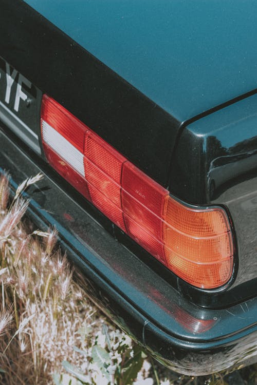 Old car parked on grassy ground