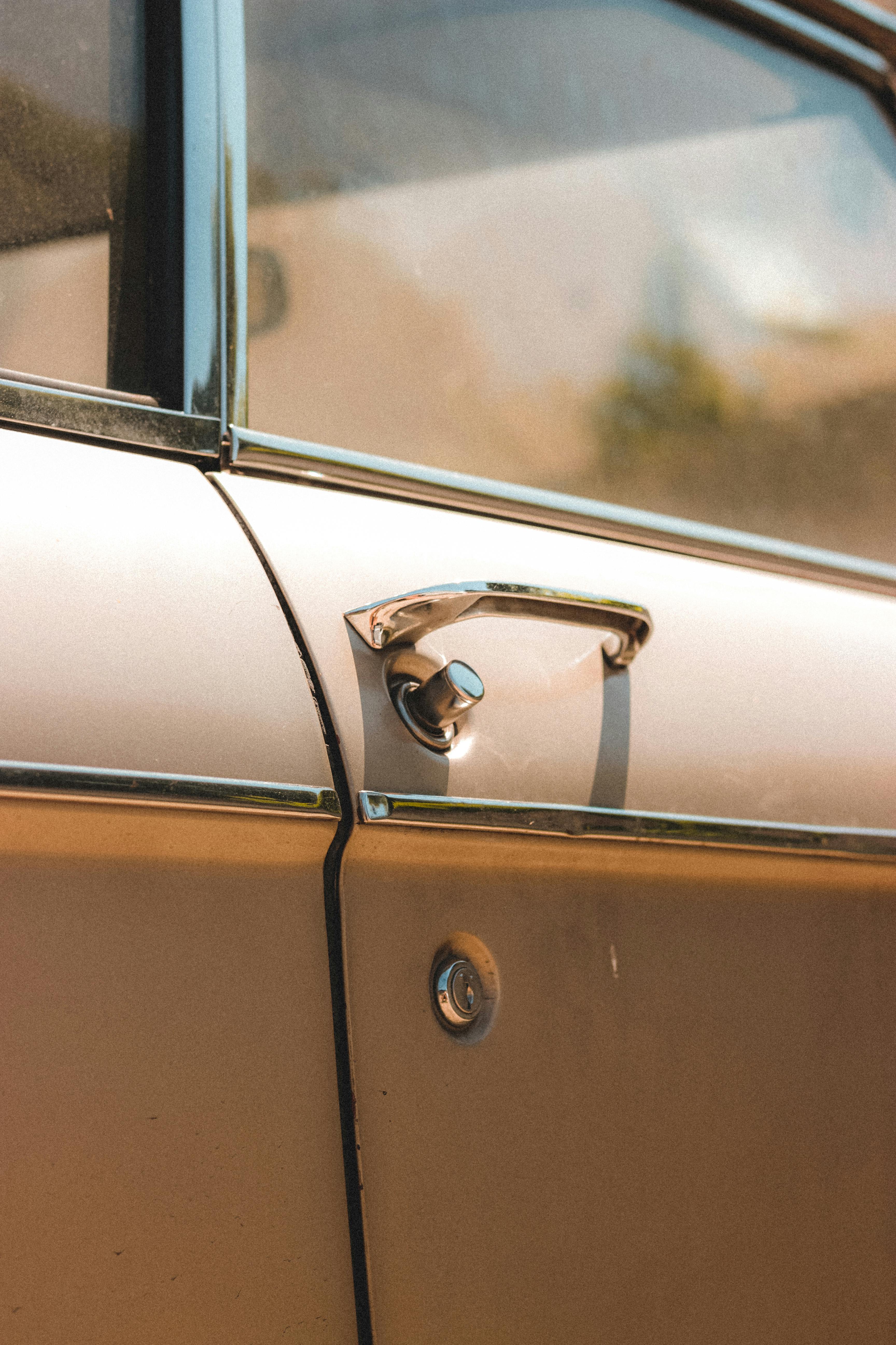 Door of vintage car parked in sunny day · Free Stock Photo