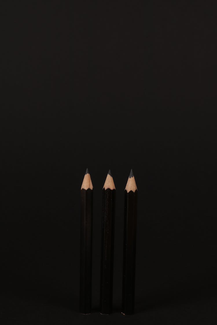 A Close-Up Shot Of Black Sharpened Pencils