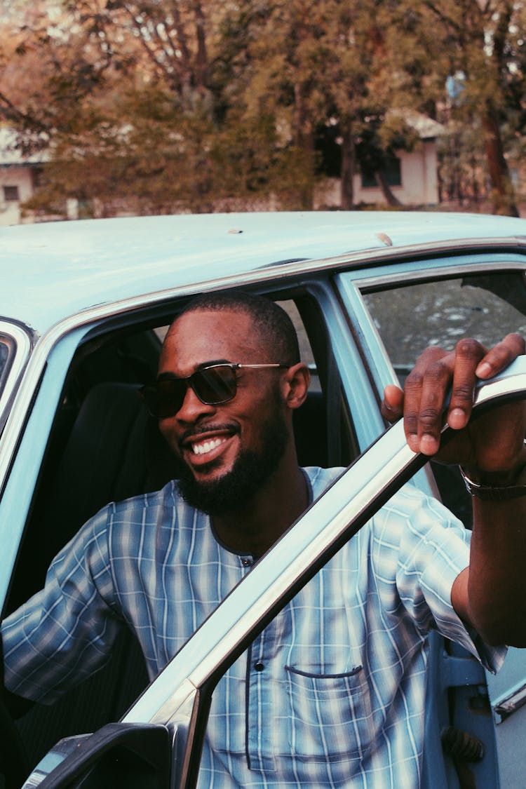 Happy Black Man Near Vintage Car On Street