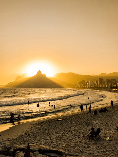 People at the Beach During Sunset