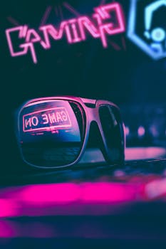 Stylish sunglasses reflecting a neon gaming sign in a vibrant, colorful nightlife setting.