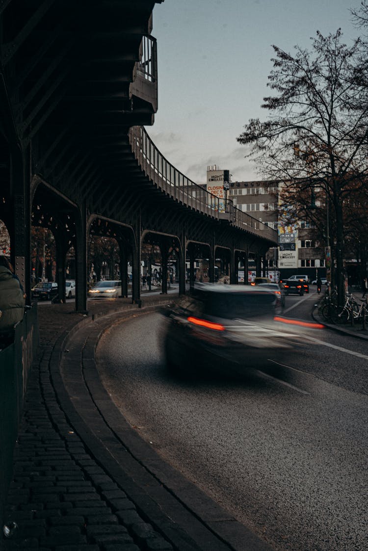 Black Car On Road Near Building