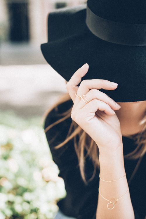 Free Elegant woman in stylish black hat and jewelry showcasing modern fashion trends. Stock Photo