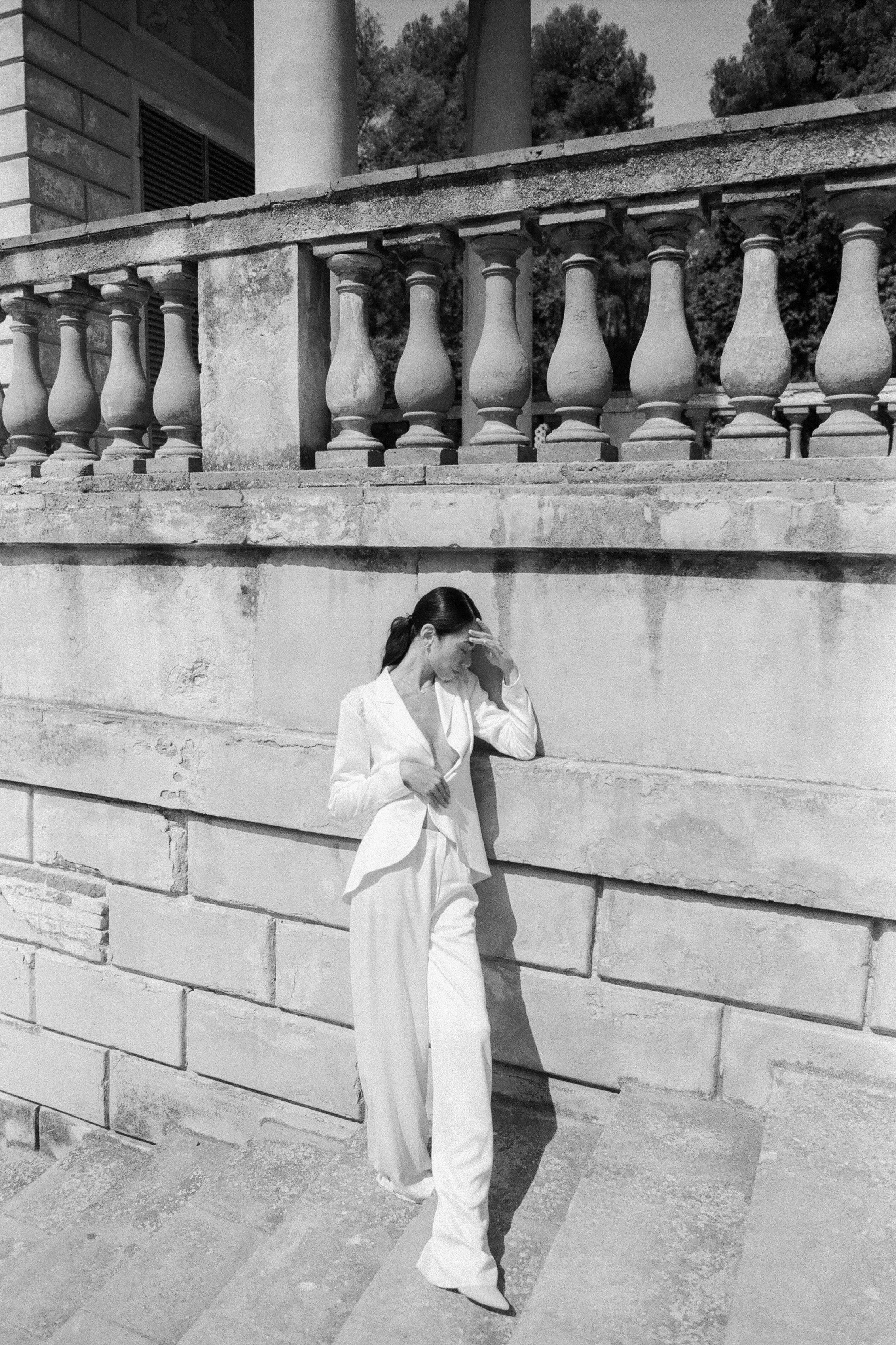 Grayscale Photo of a Woman in White Long Sleeve Shirt and Pants ...
