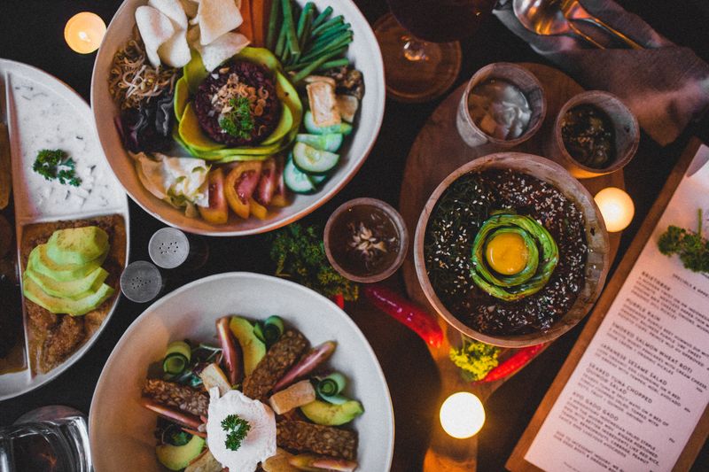 Overhead spread of shared plates — photo by Roman Odintsov on Pexels