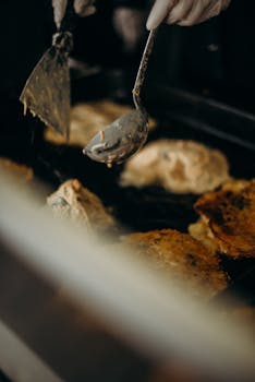 A close-up view of Korean street food being prepared outdoors.