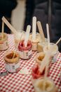 Three White Plastic Cups With Straws
