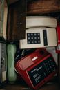 Black and White Ip Desk Phone Beside Brown Leather Wallet