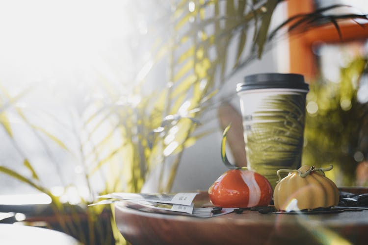 Takeaway Coffee And Glazed Pastries On Table In Street Cafe