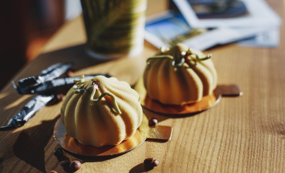 Appetizing velour glazed pastries on cafe table
