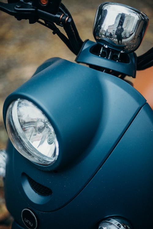 Blue Motorcycle With Black and Silver Motorcycle Wheel