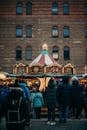 People in a Brown and Blue Carousel in a City