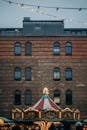 Brown Brick Building With Flag on Top
